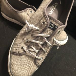 Sperry slip on sneakers.